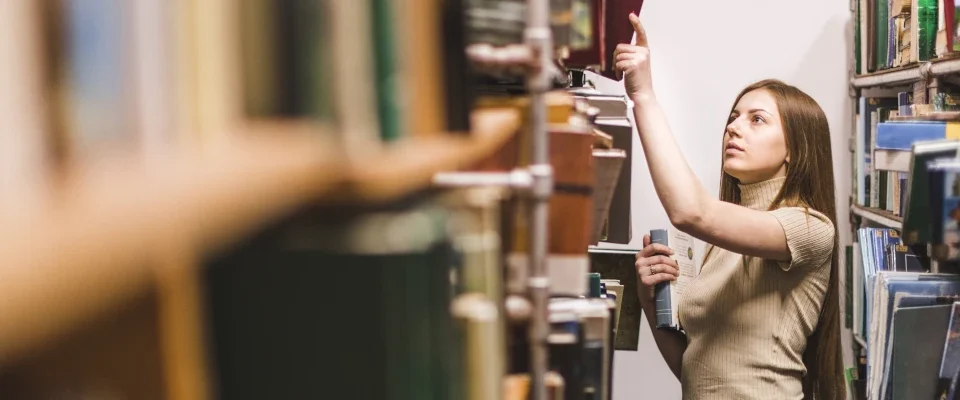 back school concept with woman studying library