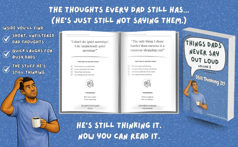 Dad laughing while reading a funny parenting book for fathers