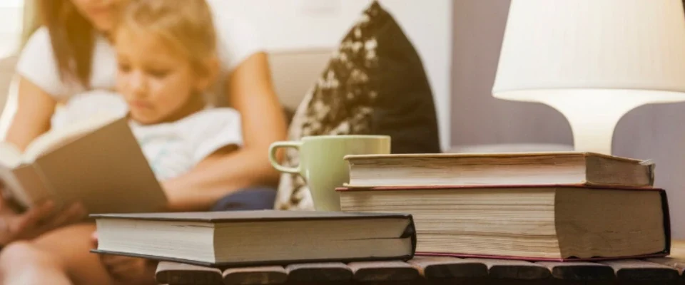 Books cup lamp standing on table