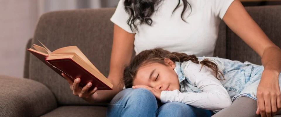 Close-up bed time story for daughter