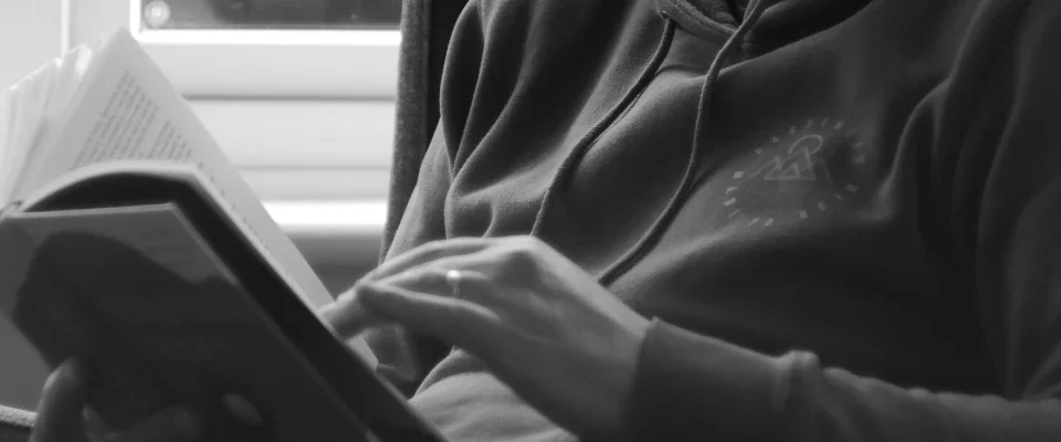 man sitting reading a book