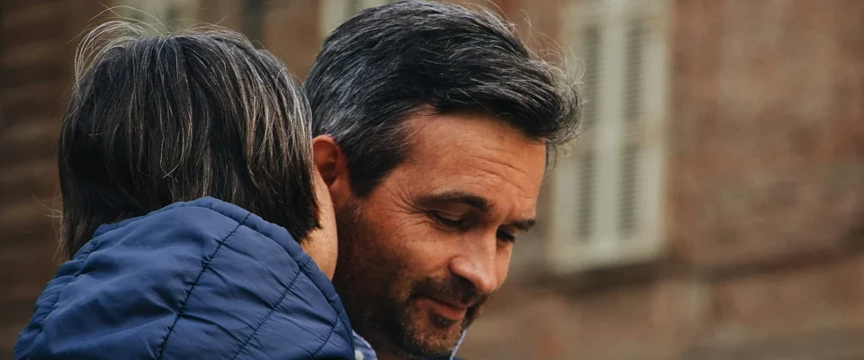woman whispering to a man