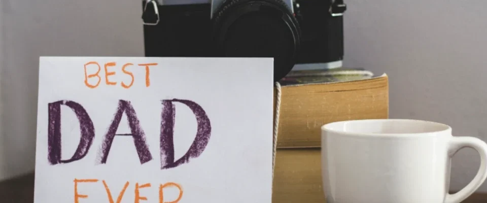 Father's day composition with camera and cup