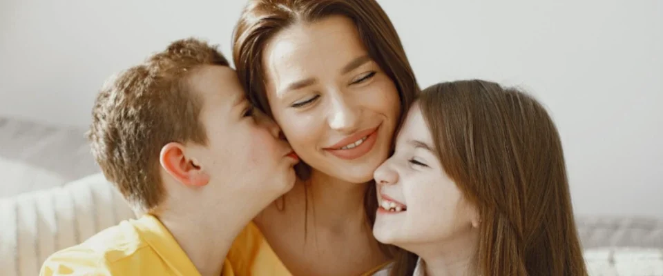 Mother with daughter and son at home